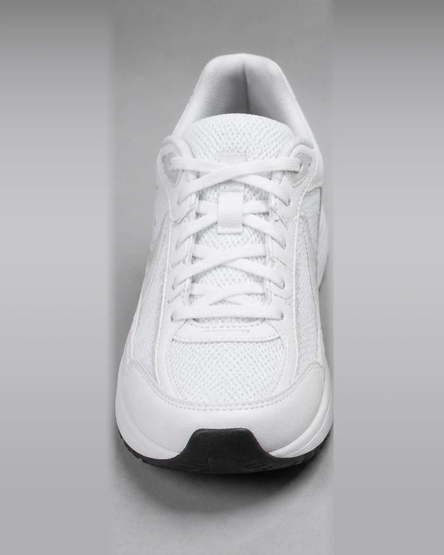 The same white trainer after a PairRevive wash, clean and bright